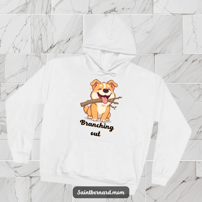 Funny Hoodie: A large, happy dog carrying a small, fallen branch in its mouth, a symbol of outdoor playfulness.