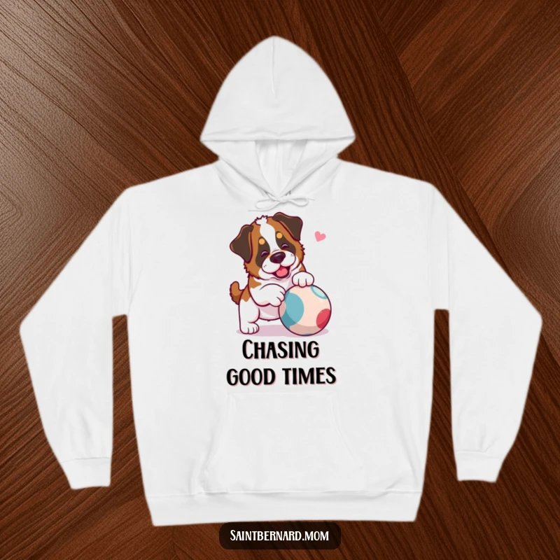 Funny Saint Bernard Lady Hoodie featuring a dog playfully nudging a rolling ball, perfect for active relaxation and cozy fun.