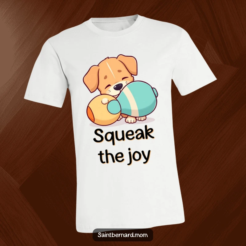 Funny T-Shirt: A dog with one floppy ear playfully nudging a comically large squeaky toy, ready for fun.